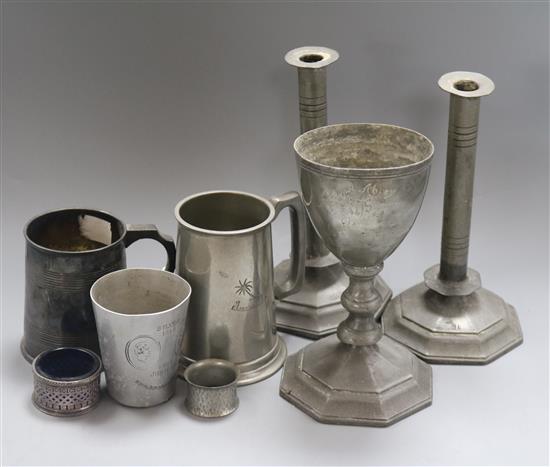 A 19th century York pewter altar set, a pair of pewter candlesticks and tankards